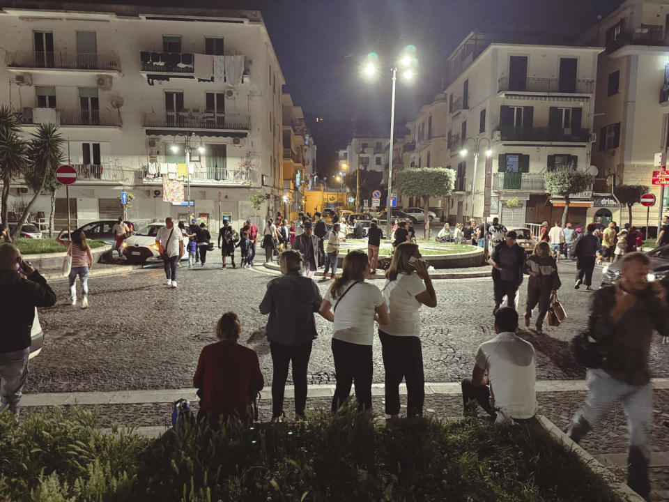People gather in a street after an earthquake in Campi Flegrei, near Naples, Italy, Tuesday, May 20, 2024. The quake is the strongest ever recorded around the Phlegraean Fields, a sprawling area of ancient volcanic centers near the Tyrrhenian Sea that encompasses western neighborhoods of Naples and its suburbs, said Giuseppe De Natale, a vulcanologist of Italy’s INGV national geophysics and vulcanology center. (Alessandro Garofalo/LaPresse via AP)