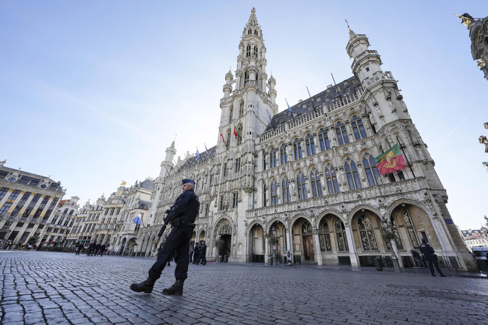 Belgian Police patrol the Grand Place in central Brussels, Tuesday, Oct. 17, 2023, following the shooting of two Swedish soccer fans were shot by a suspected Tunisian extremist on Monday night. Police in Belgium have shot dead a suspected Tunisian extremist accused of killing two Swedish soccer fans in a brazen attack on a Brussels street before disappearing into the night on Monday. (AP Photo/Martin Meissner)