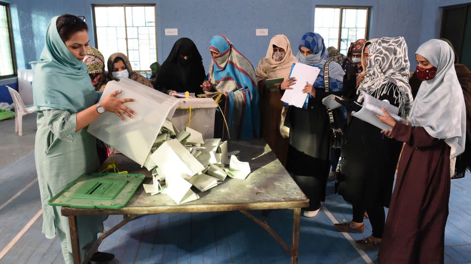 Polling staff open ballot boxes in the presence of polling agents from various political parties as they start counting votes in Quetta, Pakistan on February 8, 2024. - Banaras Khan/AFP/Getty Images