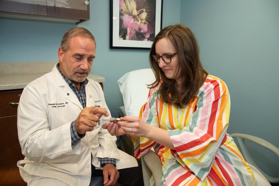 Tricia VanderHaar at a follow up visit at the Beamont Women's Urology and Pelvic Health Center, with urologist Dr. Kenneth Peters Md and after her sacral neuromodulation implant.