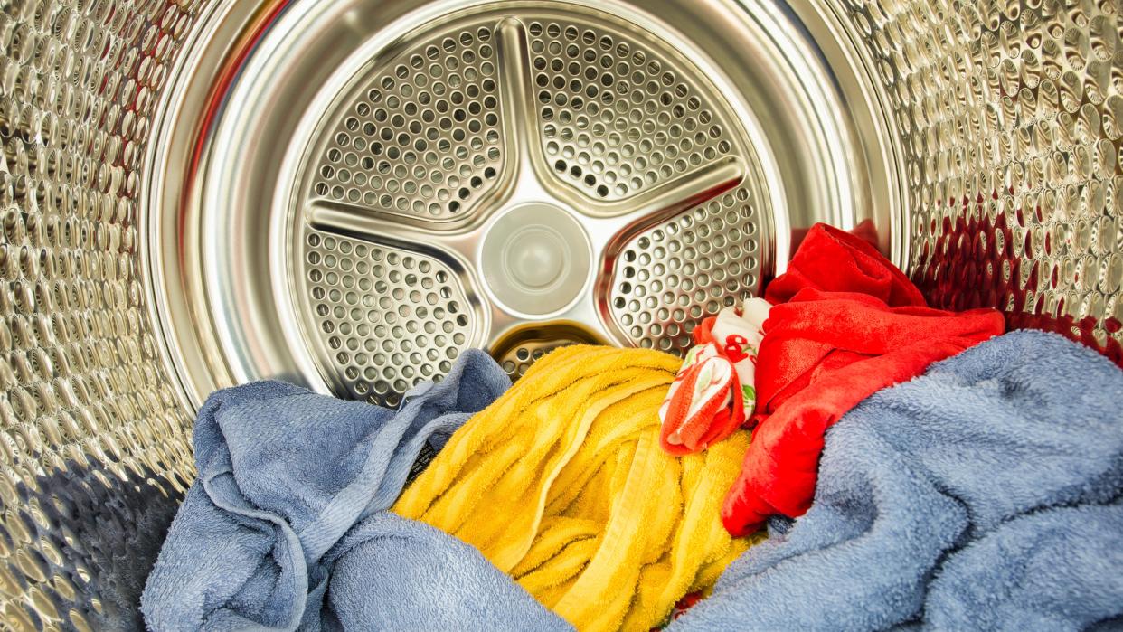  Laundry drying inside of a tumble dryer. 