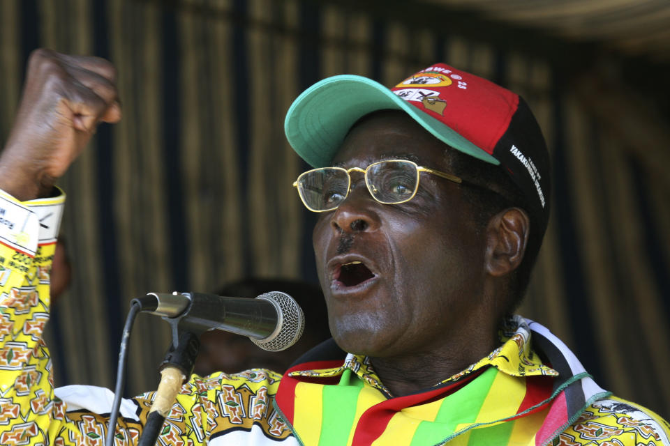 FILE - In this Tuesday, March 18, 2008 file photo, Zimbabwe President Robert Mugabe addresses party supporters at a rally in Gweru, about 250 kms. (155 miles) south of Harare. On Friday, Sept. 6, 2019, Zimbabwe President Emmerson Mnangagwa said his predecessor Robert Mugabe, age 95, has died. (AP Photo/Tsvangirayi Mukwazhi, file)