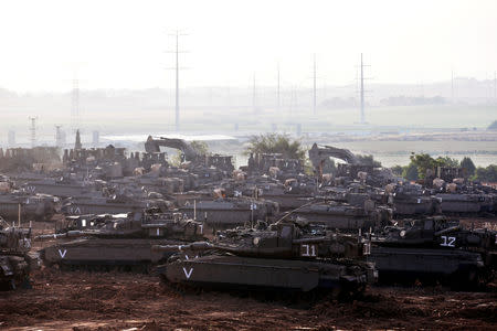 Israeli tanks, armoured personnel carriers (APC) and other military armoured vehicles gather near the border with Gaza, in southern Israel May 6, 2019. REUTERS/Ronen Zvulun