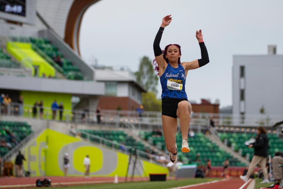 Federal Way’s Cassandra Atkins takes off in the girls triple jump on day two of the Oregon Relays Saturday, April 20, 2024, at Hayward Field in Eugene, Ore.