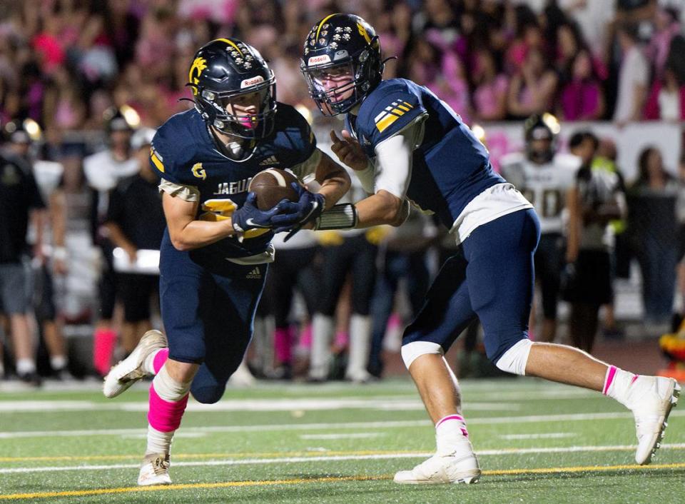 Gregori quarterback Conner Bailey hands the ball off to Michael Marsden during the Central California Athletic League game at Gregori High School in Modesto, Calif., Friday, Oct. 6, 2023.