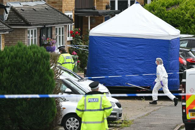 <p>JUSTIN TALLIS/AFP via Getty</p> The crime scene in Bushey, Hertfordshire