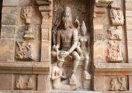 Anugraha Sandeswaramoorthi at Gangaikonda Cholapuram. This is the sculpture of Anugraha Sandeswara Moorthi (Lord Shiva) at Gangaikonda Cholapuram, a masterpece of Chola architectural splendour. It was built by Rajendra Chola, son of the great Rajaraja, from 1012-44. It is a replica of the Big Temple at Thanjavur but with still greater detail and perfection. This was the capital of the Cholas during the reign of Rajendra Chola. Visitors should not miss this beautiful sculpture near the north entrance, depicting Shiva and Parvathi garlanding the saint Sandeswara.