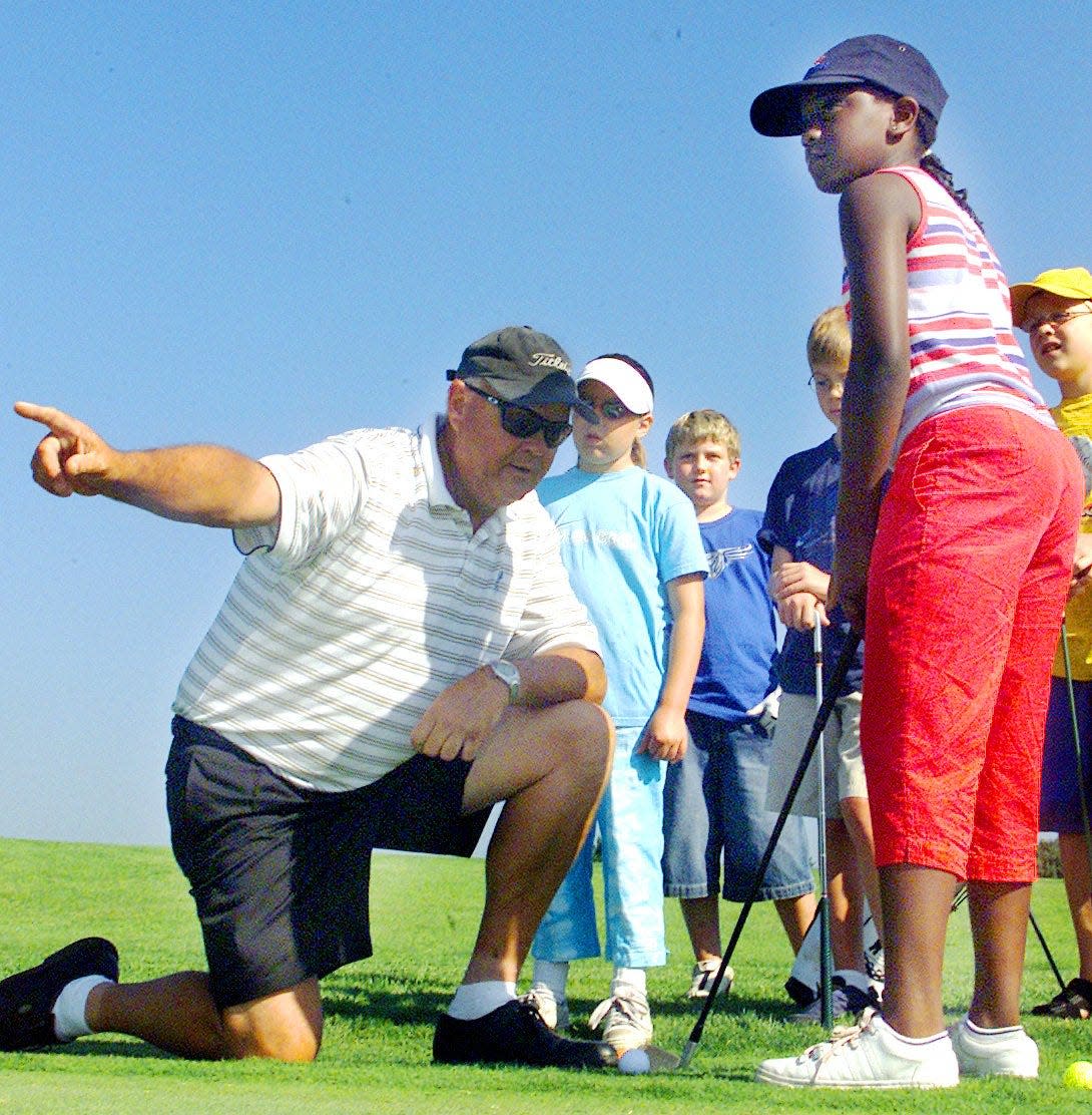 Five-time Rockford Men's City champion Lloyd McWilliams, shown here at a clinic in 2003, also became one of the Rockford Park District's top junior golf instructors. McWilliams died Saturday at age 76.