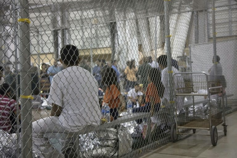 Undocumented immigrants wait in a detention center in McAllen, Texas