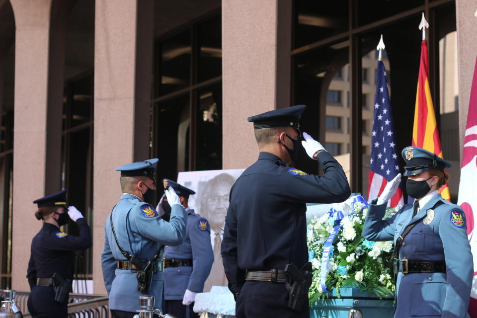 Members of the Phoenix Police Department stand vigil during the open casket viewing of former Phoenix Vice Mayor and city councilman Calvin C. Goode at the Calvin C. Goode Municipal Building in Phoenix, Ariz. on Saturday, Jan. 9, 2021. Goode died on Wednesday, Dec. 23, 2020. He was 93. (AP Photo/Cheyanne Mumphrey)