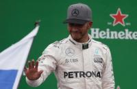 Formula One - F1 - Italian Grand Prix 2016 - Autodromo Nazionale Monza, Monza, Italy - 4/9/16 Mercedes' Lewis Hamilton celebrates second place on the podium Reuters / Max Rossi Livepic