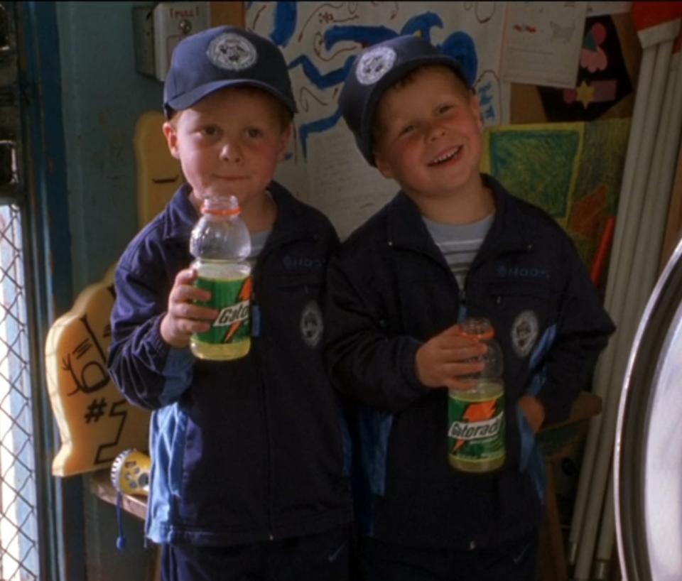 Nigel and Kyle Baker drink Gatorade in their dad's office