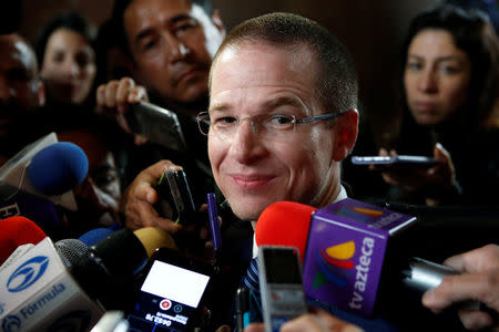 Ricardo Anaya, presidential candidate for the National Action Party (PAN), leading the left-right coalition "For Mexico in Front", takes questions from the media after a meeting at the Club de Industriales in Mexico City, Mexico February 21, 2018. REUTERS/Ginnette Riquelme