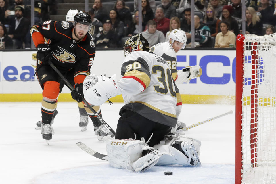 Anaheim Ducks left wing Nick Ritchie, left, scores past Vegas Golden Knights goaltender Malcolm Subban nduring the second period of an NHL hockey game in Anaheim, Calif., Sunday, Feb. 23, 2020. (AP Photo/Chris Carlson)