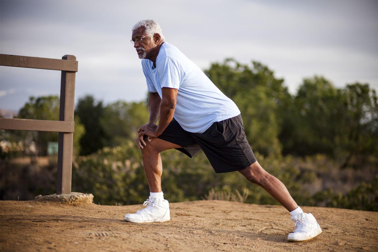 Senior man doing lunges