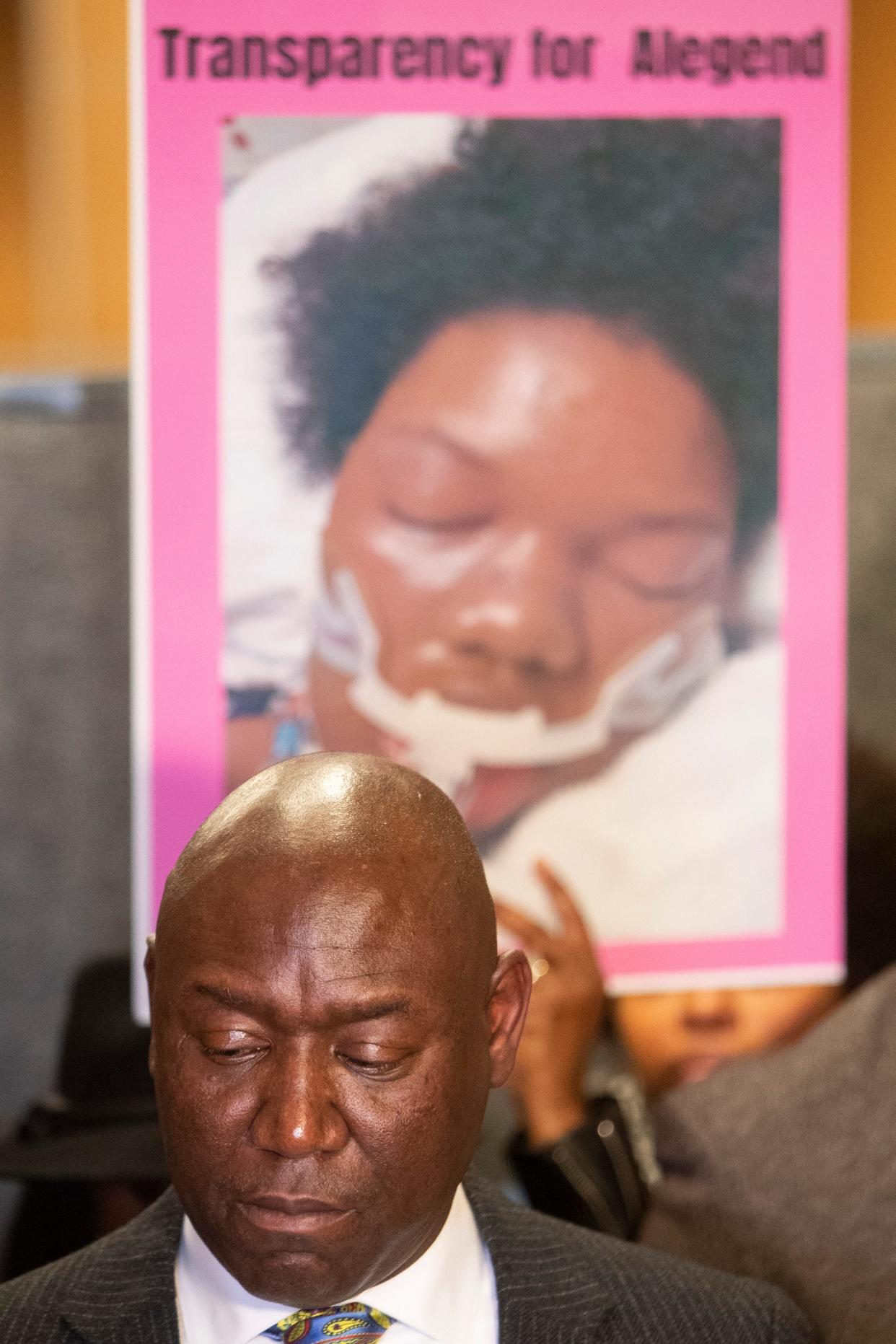 Attorney Ben Crump stands in front of a poster stating “transparency for Alegend,” over a photo of her in the hospital after an altercation between Jones and Youth Villages staff that Crump and the Jones family allege resulted in her death during a press conference outside Shelby County District Attorney Steve Mulroy’s office in Memphis, Tenn., on Wednesday, December 27, 2023.