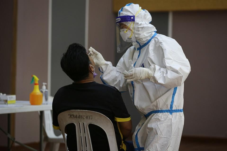 Health workers collect swab samples to test for Covid-19 at Dewan MBPJ in Petaling Jaya February 6, 2021. — Picture by Yusof Mat Isa