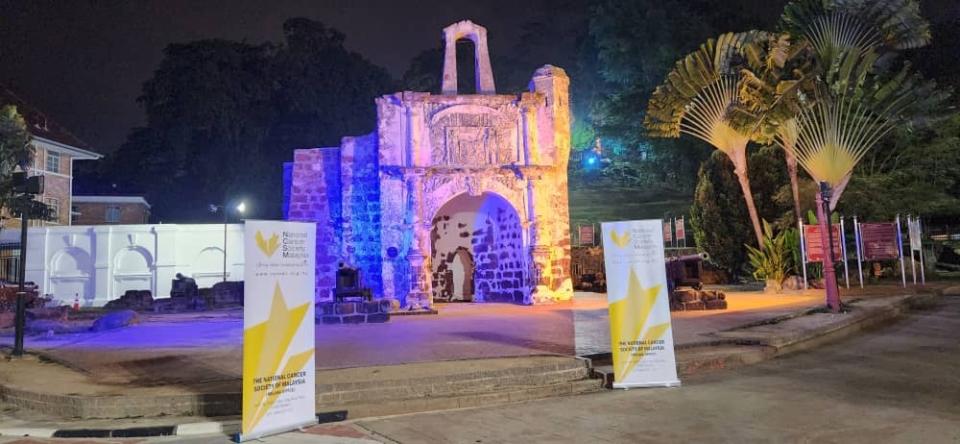 A Famosa Fort bathed in the warm glow of blue and orange, joining hands to raise awareness on World Cancer Day on February 4, 2024. — Picture courtesy of National Cancer Society Malaysia 