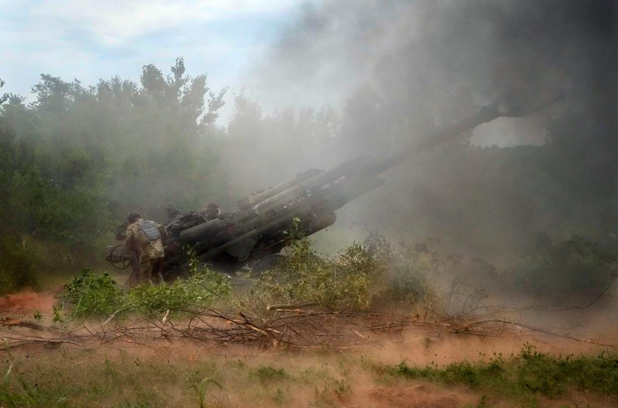 FILE - Ukrainian soldiers fire at Russian positions from a U.S.-supplied M777 howitzer in Ukraine's eastern Donetsk region June 18, 2022.