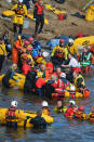 PITTENWEEM, SCOTLAND - SEPTEMBER 02: Emergency services attempt to rescue a large number of pilot whales who have beached on September 2, 2012 in Pittenweem near St Andrews, Scotland. A number of whales have died after being stranded on the east coast of Scotland between Anstruther and Pittenweem. (Photo by Jeff J Mitchell/Getty Images)