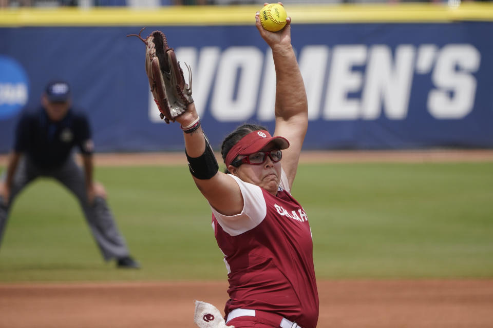 Oklahoma's Giselle Juarez pitches in the first inning of an NCAA Women's College World Series softball game against James Madison, Monday, June 7, 2021, in Oklahoma City. (AP Photo/Sue Ogrocki)