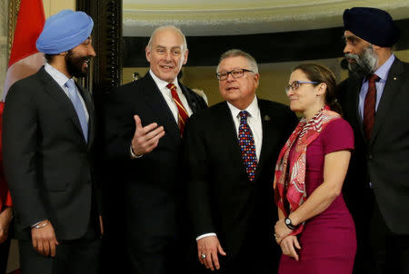 U.S. Homeland Security Secretary John Kelly (2nd L) poses with Canada's Innovation, Science and Economic Development Minister Navdeep Bains (L), Public Safety Minister Ralph Goodale (C), Foreign Minister Chrystia Freeland (2nd R) and Defence Minister Harjit Sajjan on Parliament Hill in Ottawa, Ontario, Canada, March 10, 2017. REUTERS/Chris Wattie