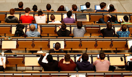 FILE PHOTO: Students attend a lecture in the auditorium of a university in Munich, Germany, May 25, 2016. REUTERS/Michaela Rehle/File Photo