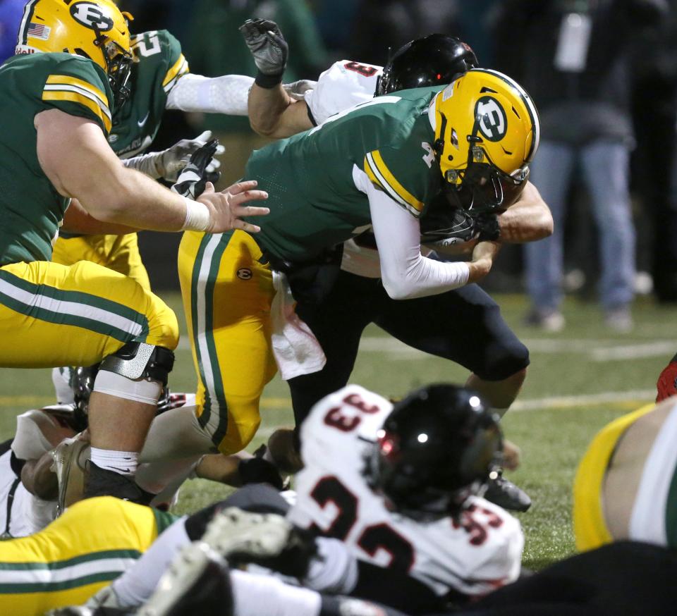 Christian Ramos, 4, of St. Edward runs for a touchdown during their DI regional semifinal game against McKinley at Parma on Friday, Nov. 12, 2021.