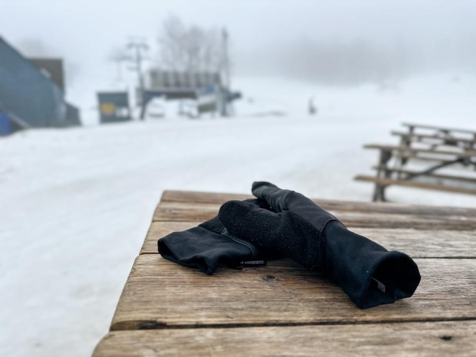 A pair of forgotten ski gloves sits on a table at Camp Fortune, in Chelsea, Que.