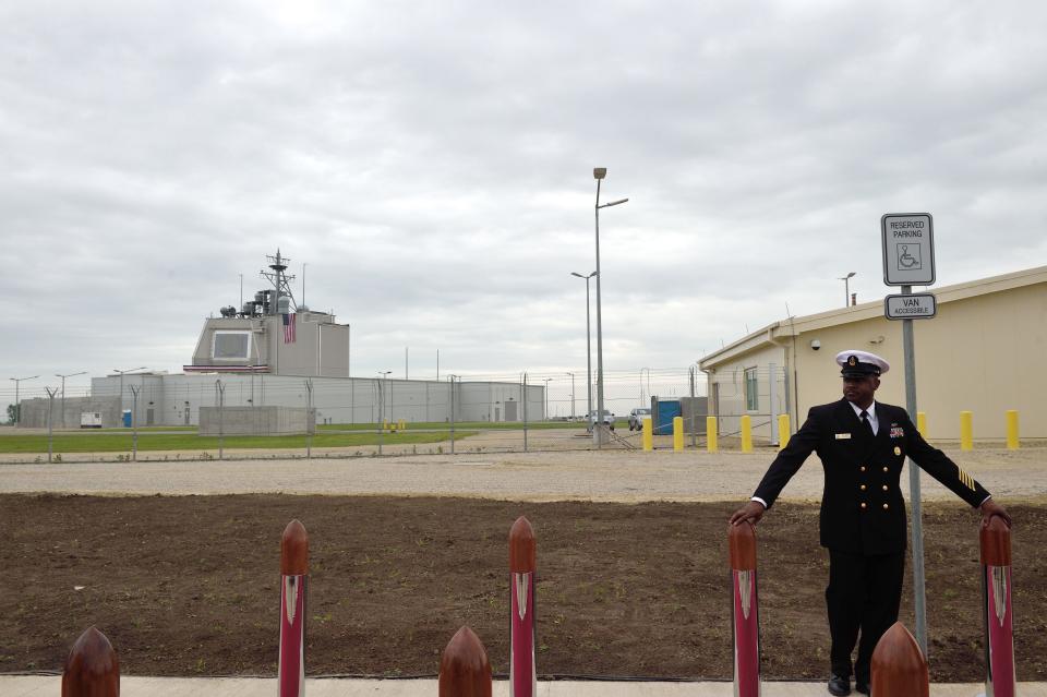 A U.S. soldier is seen before an inauguration ceremony of the U.S. anti-missile station Aegis Ashore Romania (in the background) at a military base in Deveselu, Romania, May 12, 2016.  Aegis Ashore is a land-based capability of the Aegis Ballistic Missile Defense (BMD) System. / Credit: DANIEL MIHAILESCU/AFP/Getty