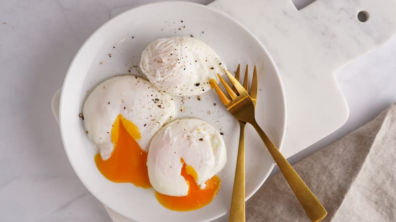 three poached eggs on plate