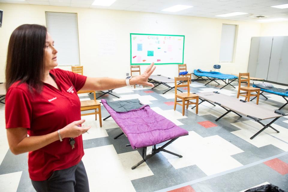 Montgomery EMA Director Christina Thornton shows the sleeping area inside the Montgomery Crisis Center in Montgomery, Ala., on Thursday, Nov. 3, 2022.
