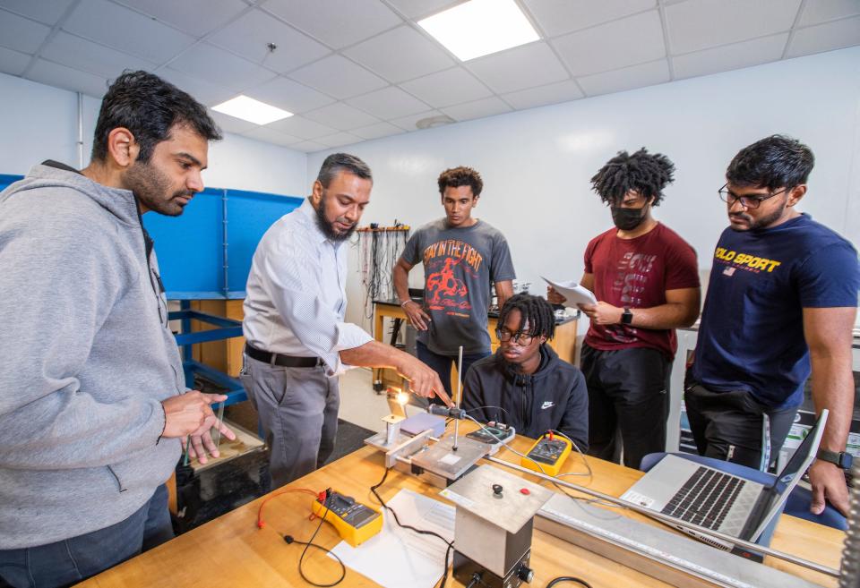 Teaching faculty Mohd Yousuf Ali, Ph.D., 2nd from left, goes over some instructions with his students in their mechanical engineering Thermal-Fluids Lab at the FAMU-FSU College of Engineering in Tallahassee, Florida.