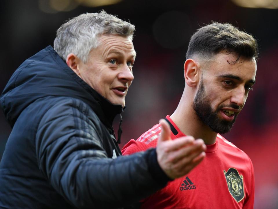 Manchester United manager Ole Gunnar Solskjaer with new signing Bruno Fernandes: AFP via Getty Images