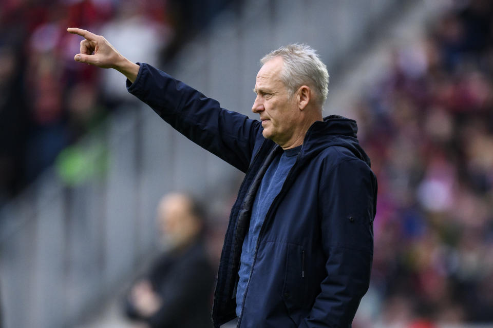 Freiburg's coach Christian Streich gestures during the German Bundesliga soccer match between TSG 1899 Hoffenheim and SC Freiburg in Freiburg im Breisgau, Germany, Sunday March 12, 2023. (Tom Weller/dpa via AP)