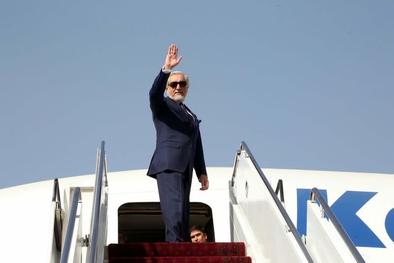 Abdullah Abdullah, Chairman of the High Council for National Reconciliation waves goodbye before departing from Kabul