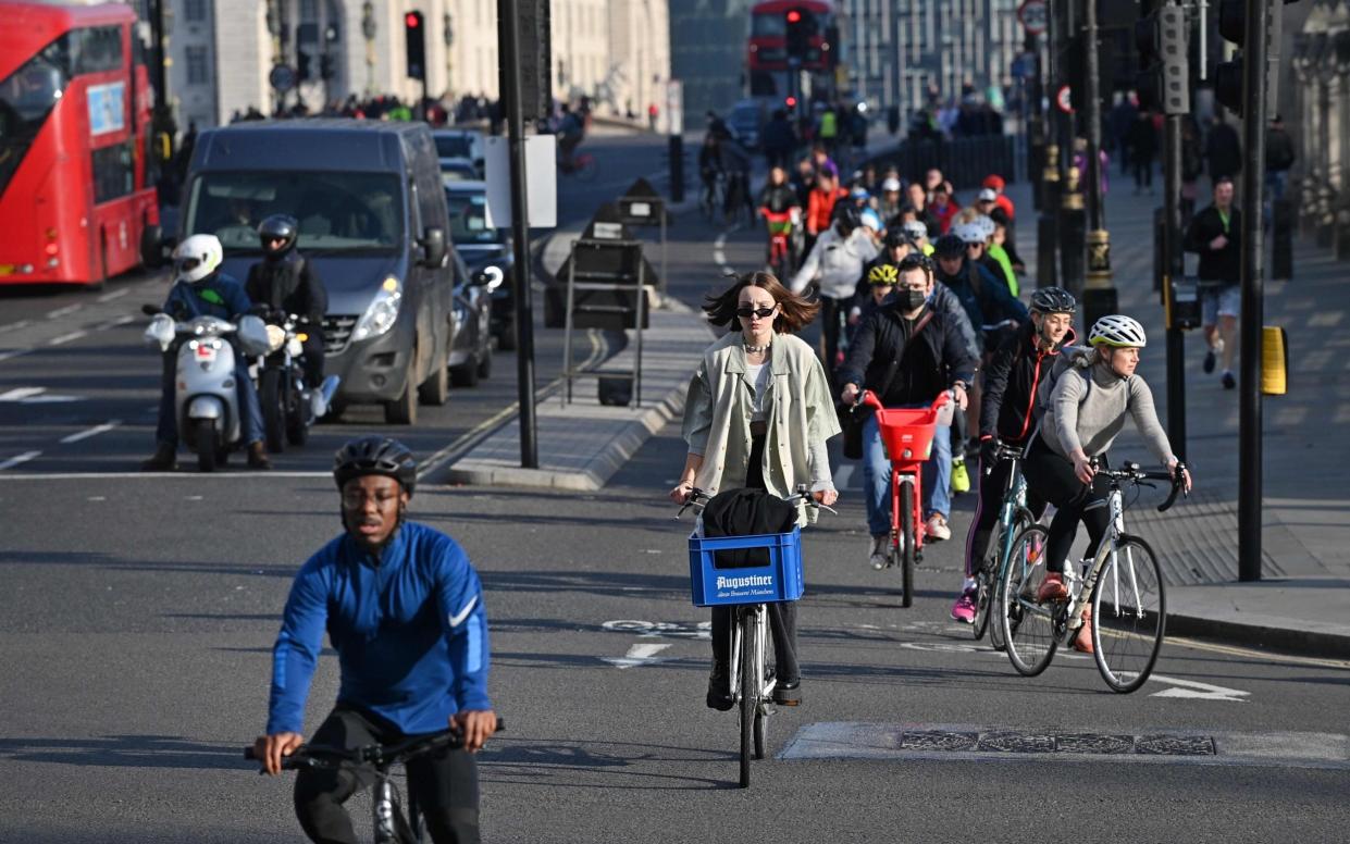 Cyclists and other traffic in Parliament Square. The installation of cycle lanes had a negative impact on congestion, because there was less space for cars to use, experts said