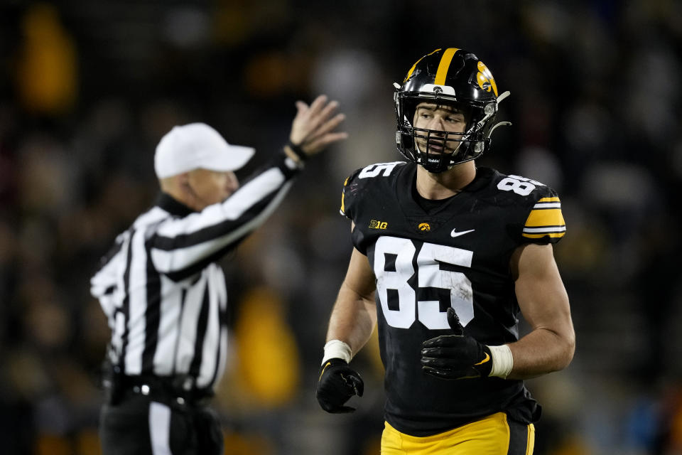 Iowa tight end Luke Lachey runs on the field during the first half of an NCAA college football game against Nebraska, Friday, Nov. 25, 2022, in Iowa City, Iowa. (AP Photo/Charlie Neibergall)