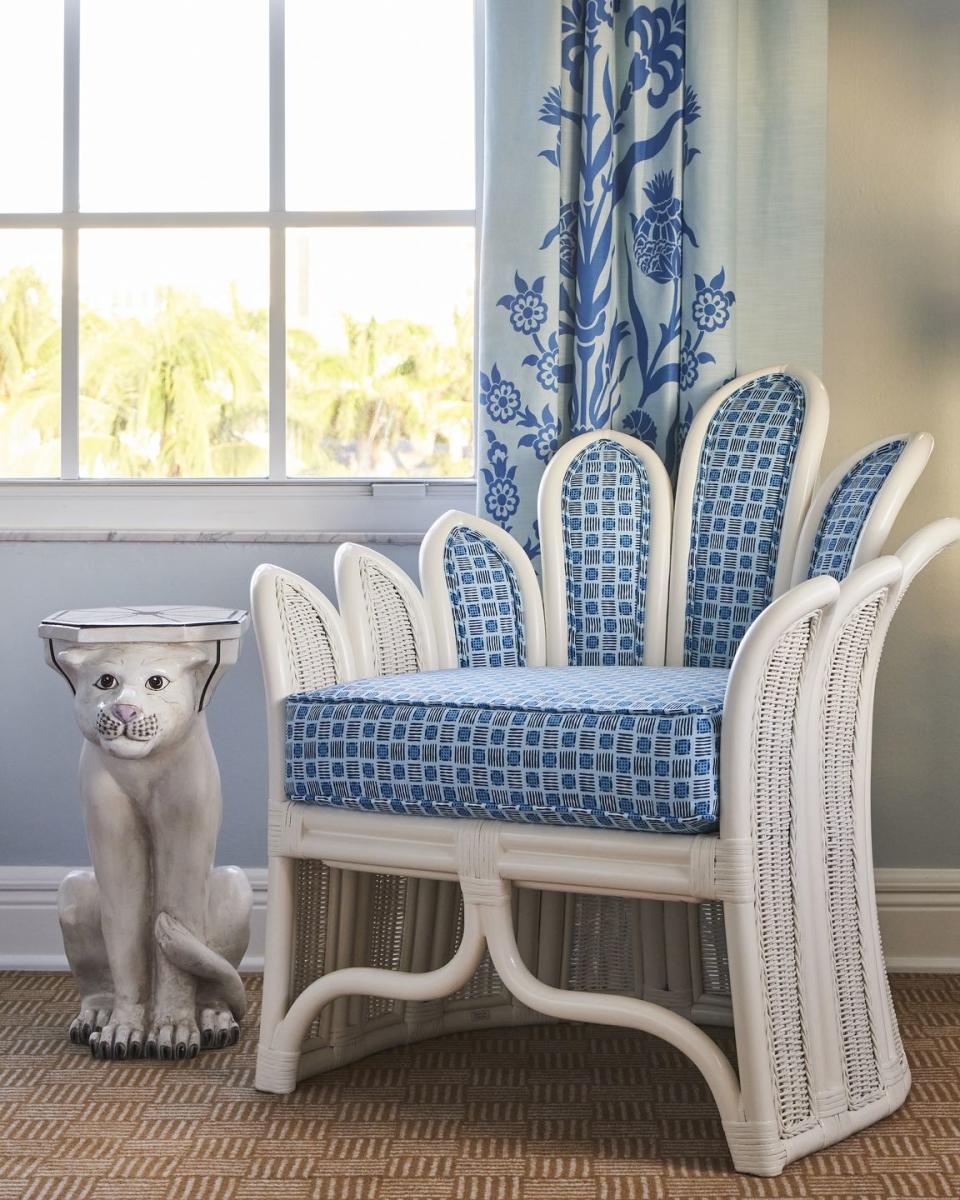 a chair by society social in a guest room at the colony hotel palm beach