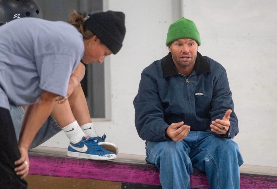 Coach of the Austrian national skateboarding team Beau Mitchell gives some tips to Liv Lovelace as she works on a trick at Woodward on Wednesday, April 24, 2024.