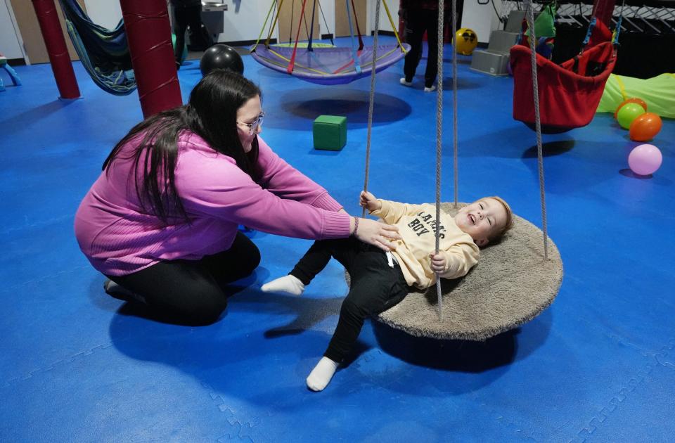 Cara Clokey plays with her son, Cohen, 2, at Rock the Spectrum Kid's Gym, 1250 E. Powell Road in Lewis Center. The gym specializes in creating a safe place for people of all abilities to play.