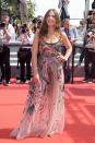 <p>La chanteuse et actrice est tout sourire dans sa robe hippie chic.<br>Crédit : Getty </p>