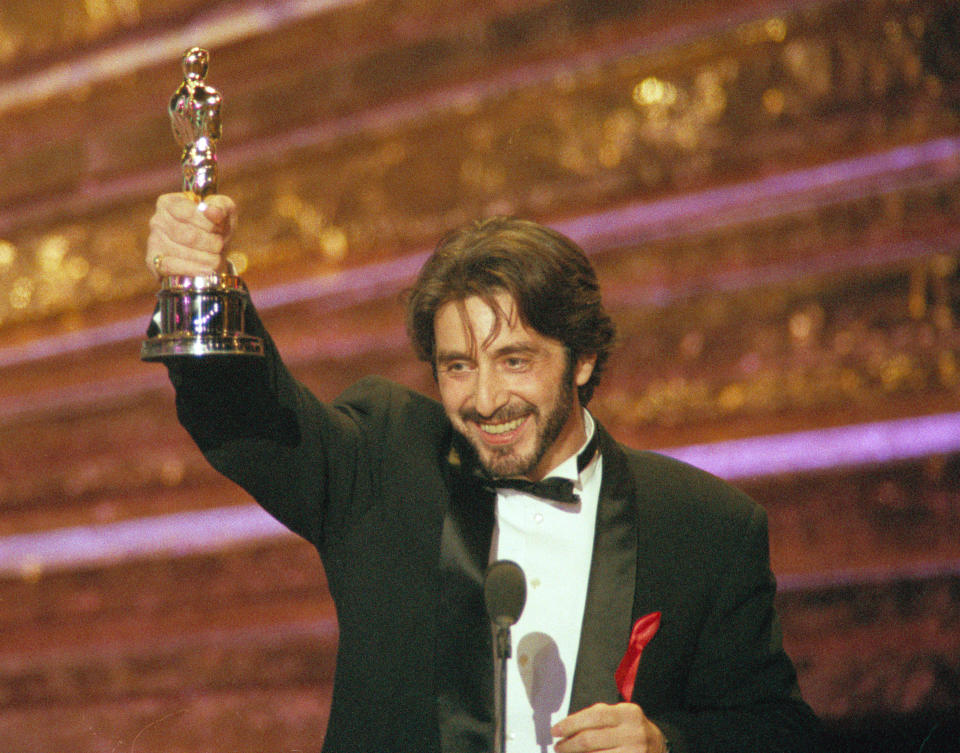 Actor Al Pacino holds up the the Oscar he won as best actor for his role in "Scent of a Woman," at the 65th annual Academy Awards show in Los Angeles, Calif., on March 29, 1993.  (AP Photo/Bob Galbraith)