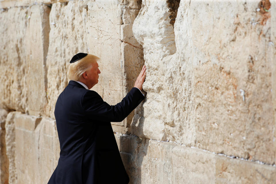 U.S. President Donald Trump touches the Western Wall, Judaism's holiest prayer site, in Jerusalem's Old City May 22, 2017. (Photo: Ronen Zvulun / Reuters)