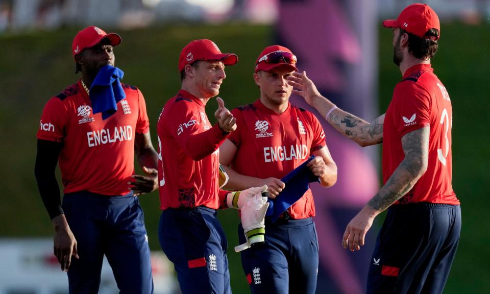 <span>England's captain, Jos Buttler (second left), celebrates with his teammates after sealing the victory against Namibia.</span><span>Photograph: Ricardo Mazalán/AP</span>