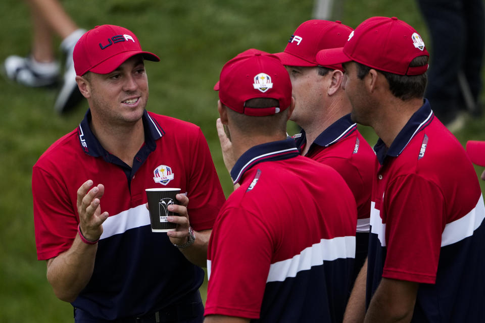 Team USA's Justin Thomas talks to teammates after winning the Ryder Cup at the Whistling Straits Golf Course Sunday, Sept. 26, 2021, in Sheboygan, Wis. (AP Photo/Jeff Roberson)