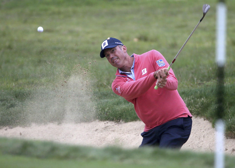 Matt Kuchar of the U.S.A. plays from a bunker on the 8th during the Australian Open Golf tournament in Sydney, Thursday, Nov. 15, 2018. (AP Photo/Rick Rycroft)