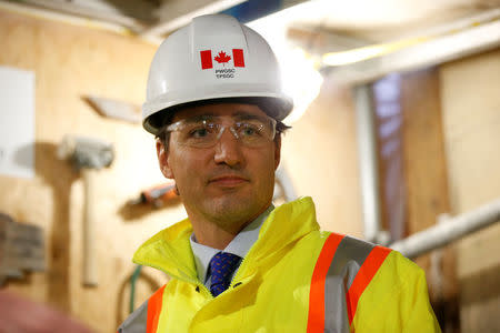 Canada's Prime Minister Justin Trudeau takes part in an event marking the completion of masonry work on West Block on Parliament Hill in Ottawa, Ontario, Canada, February 1, 2017. REUTERS/Chris Wattie