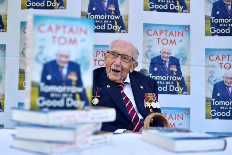 FILE PHOTO: Captain Sir Tom Moore smiles as he launches his autobiography book at his home in Milton Keynes