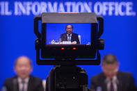 A video screen shows Ning Jizhe, commissioner of China's National Bureau of Statistics, as he speaks during a press conference at the State Council Information Office in Beijing, Tuesday, May 11, 2021. China's population growth is falling closer to zero as fewer couples have children, the government announced Tuesday, adding to strains on an aging society with a shrinking workforce. (AP Photo/Mark Schiefelbein)